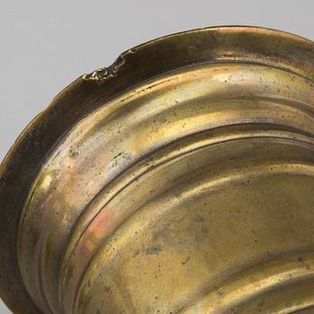 A 18th century brass mortar with pestle.