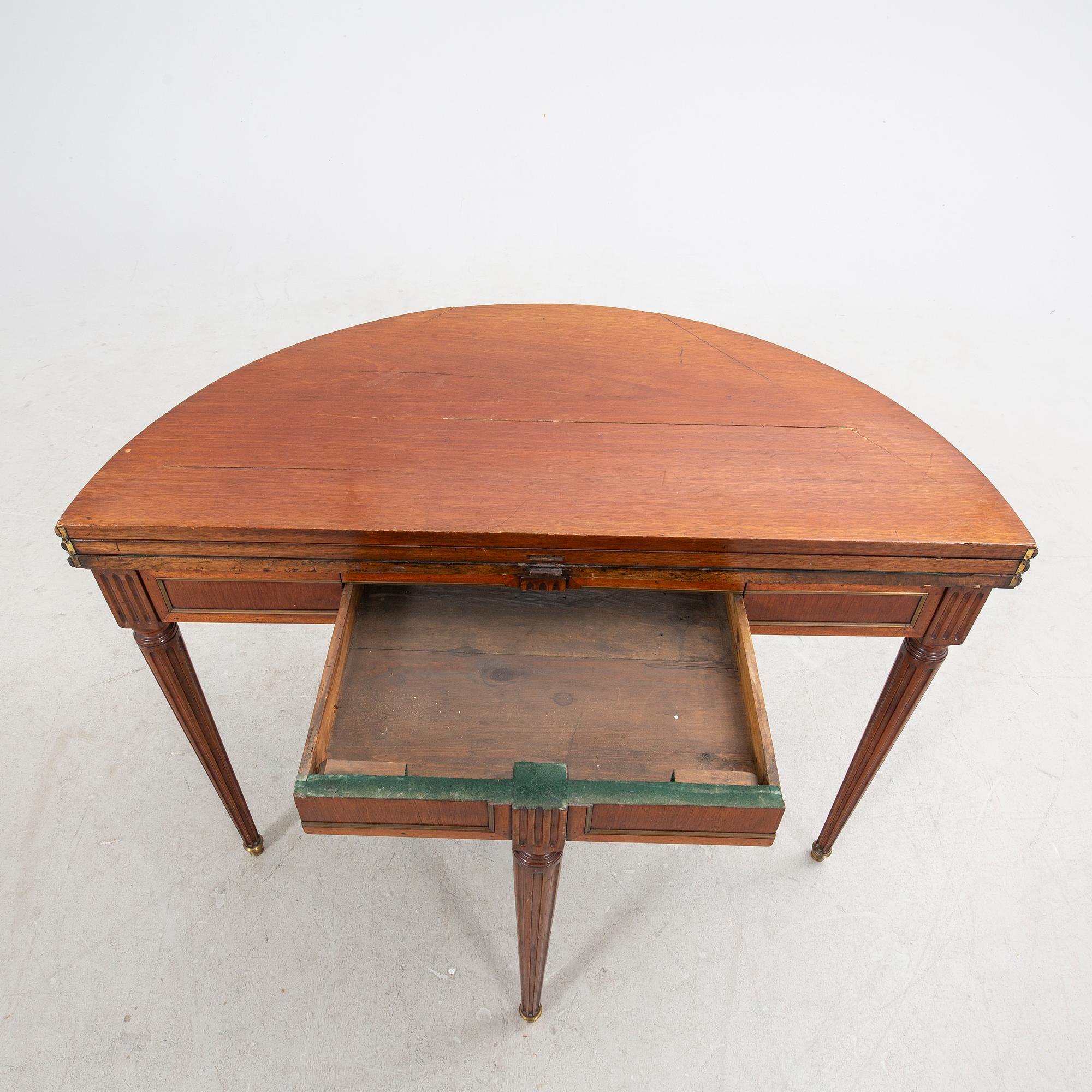 An erarly 1800s mahogany game table.