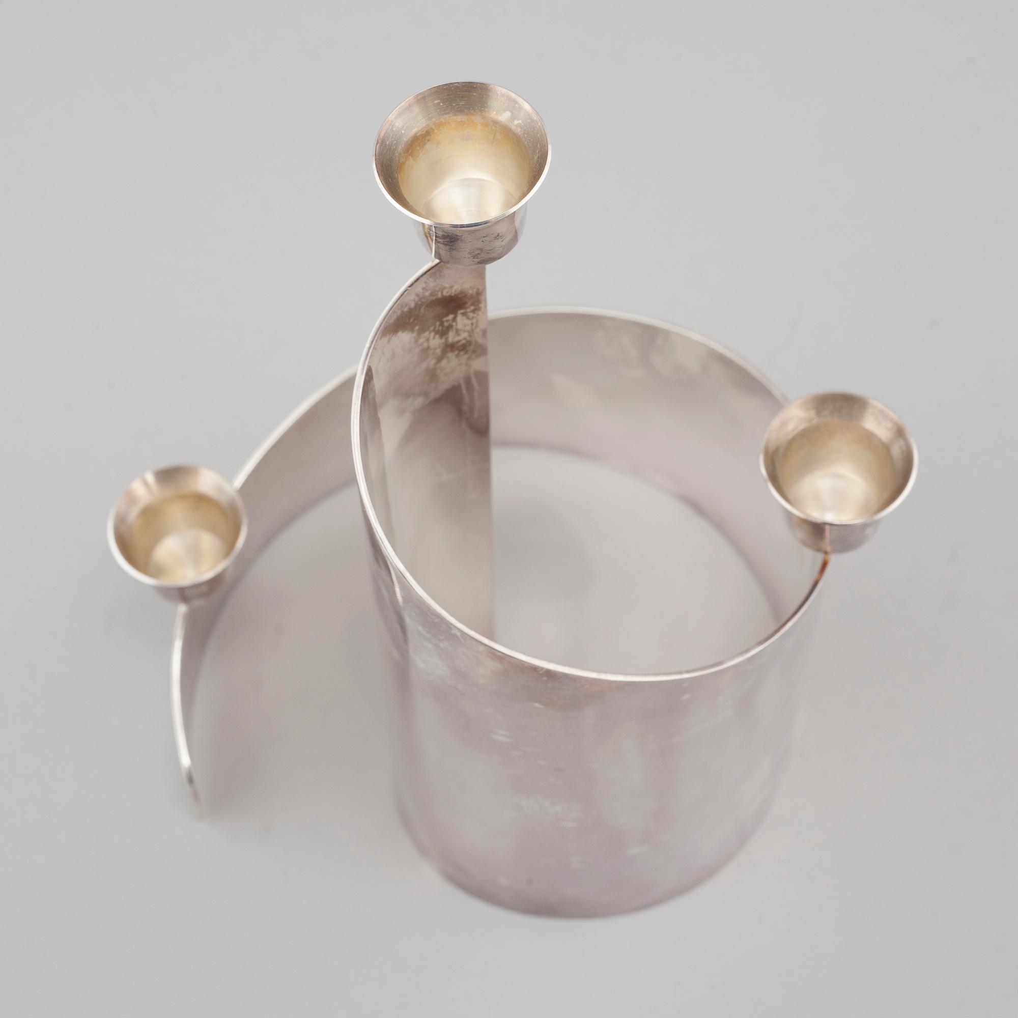 A candle holder in silver, unidentified designer, made by MEMA in linköping 1993. Weight 581 g.