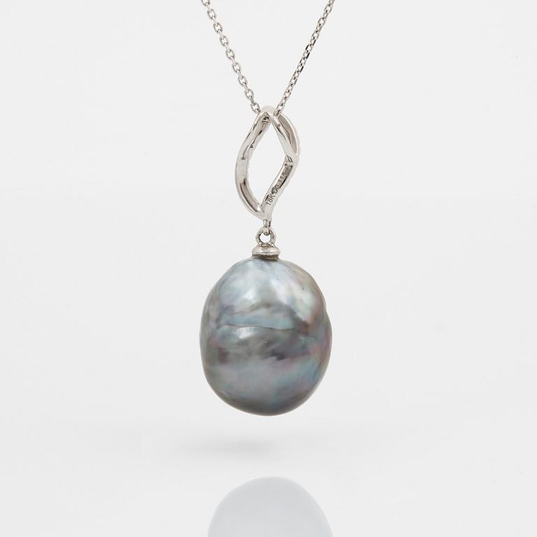 An 18K gold Tahitian cultured pearl pendant set with round brilliant-cut diamonds.