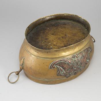 A 17th century brass and copper champagne cooler.