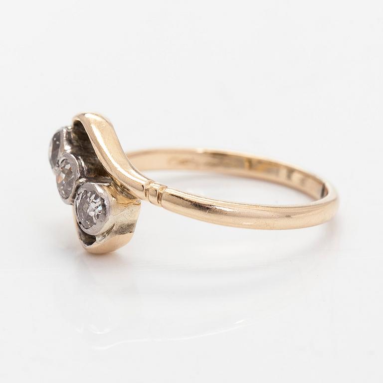 A 14K gold ring with old-cut diamonds.