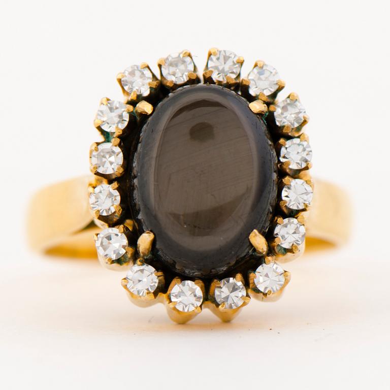 A RING, black star sapphire, 8/8 cut diamonds, 14K gold.