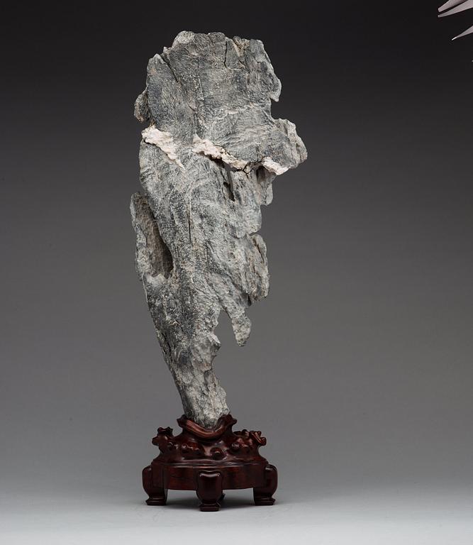 A Chinese scholars rock with a wooden stand, 20th Century.