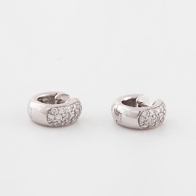 A pair of brilliant cut diamond earrings..