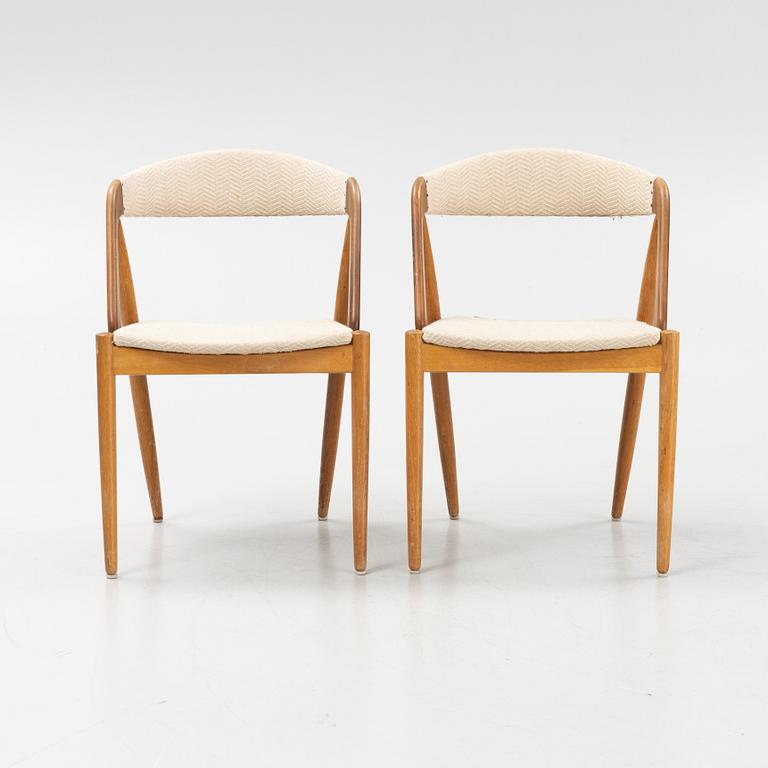 Kai Kristiansen, four walnut and oak 'Pige/T21' chairs, Denmark, 1950's/60's. Table included.