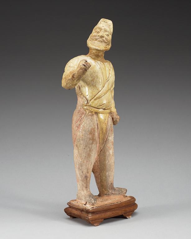 A potted figure of a camel groom, Tang dynasty (618-907).