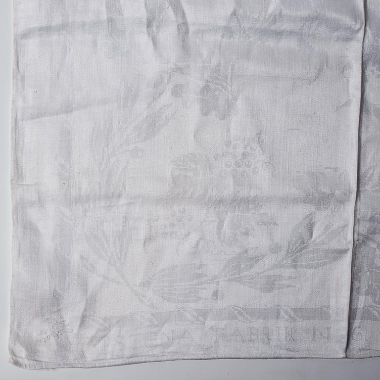 A tea table cloth, linen damask, "Lilla blomsterkorgen", ca 143,5 x 144 cm.