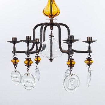 ERIK HÖGLUND,A pair of wall candle holders and a chandelier, kosta Boda, second half of the 20th century.