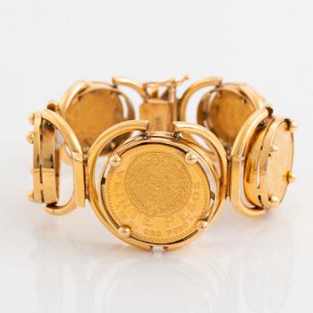 An 18K gold bracelet set with Mexican 22K gold coins.