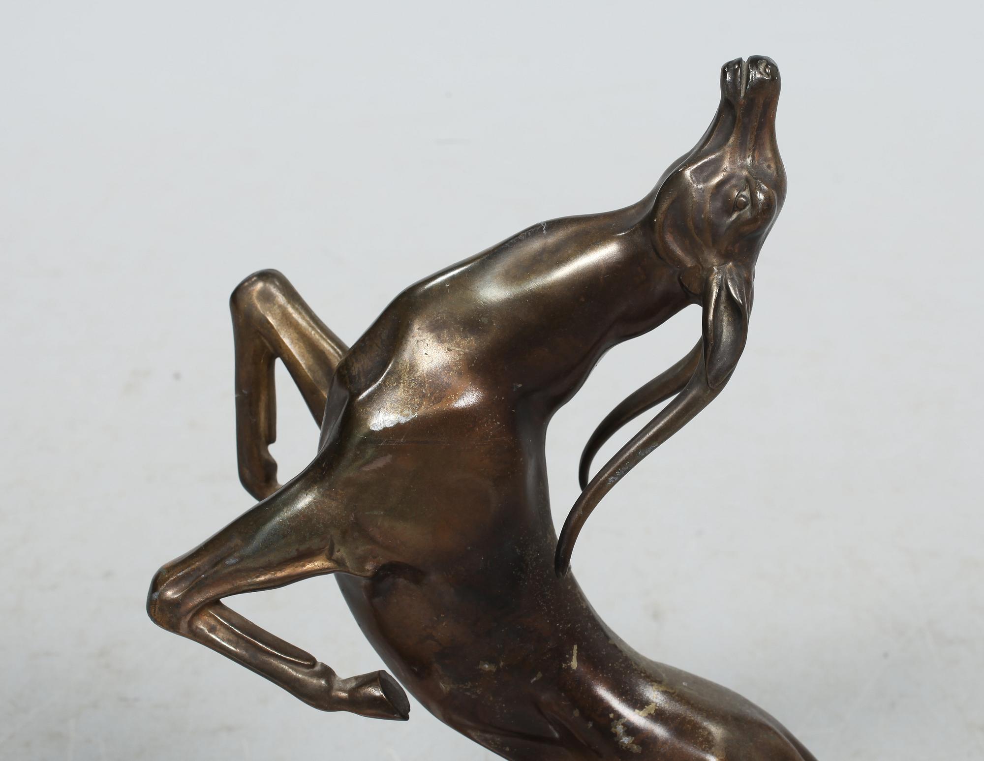SKULPTUR, patinerad metall och sten, art deco, 1900-talets andra kvartal.