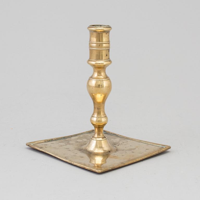 A 17th century bronze candlestick.