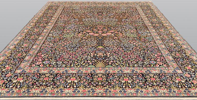 A Kirman Laver carpet, 'Millefleur', approx. 388 x 300 cm.