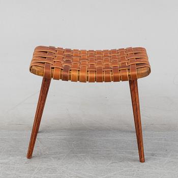 A leather upholstered stool, 1950's.