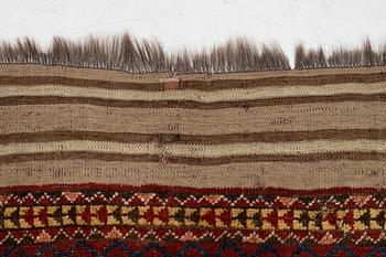 An antique Beshir carpet, ca 495 x 206 cm, around the year 1875.