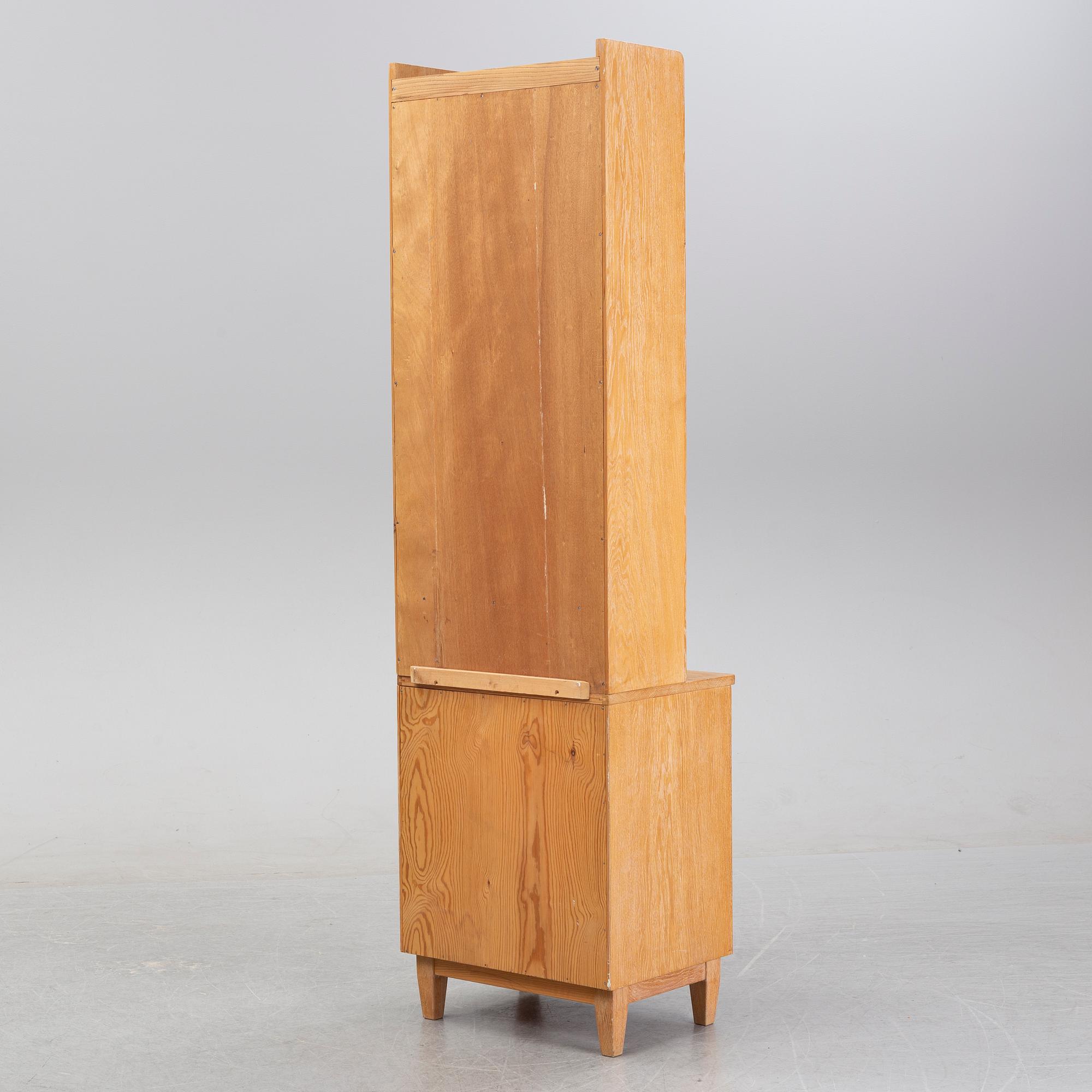 An oak book case with a cabinet, second half of the 20th Century.