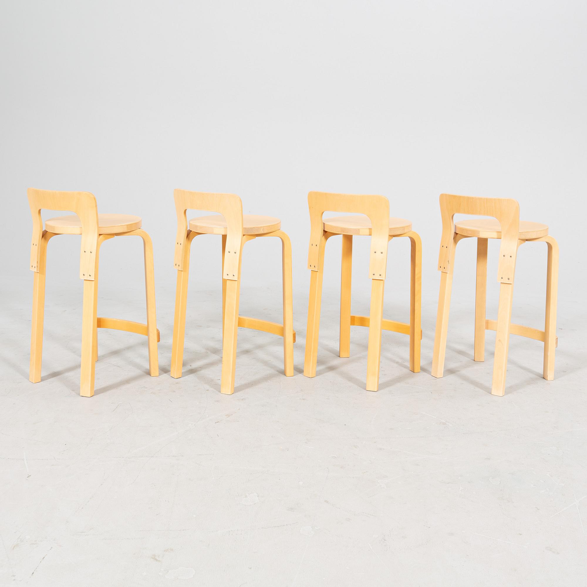 A set of four birch bar stools by Alvar Aalto, modell "K65" Artek, from the second half of 20th century.
