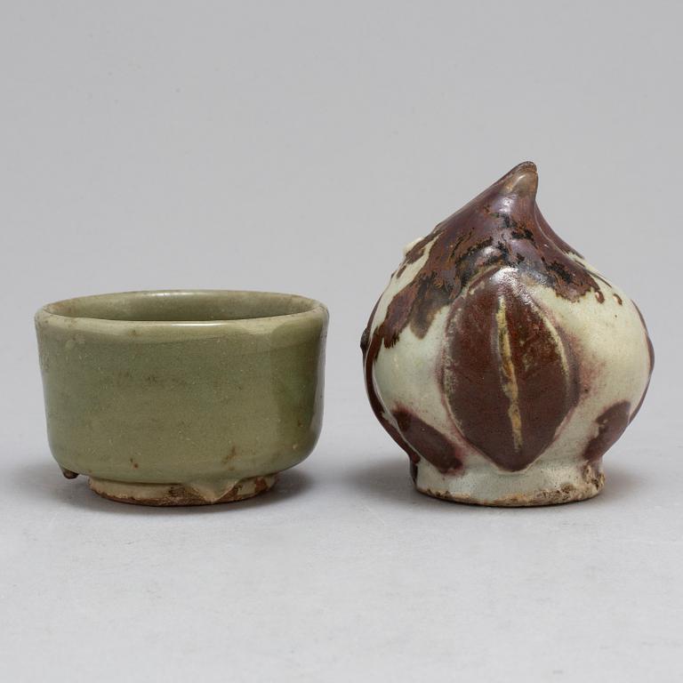 A Korean water dropper from the 19th Century and a celadon bowl, Ming dynasty (1368-1644).