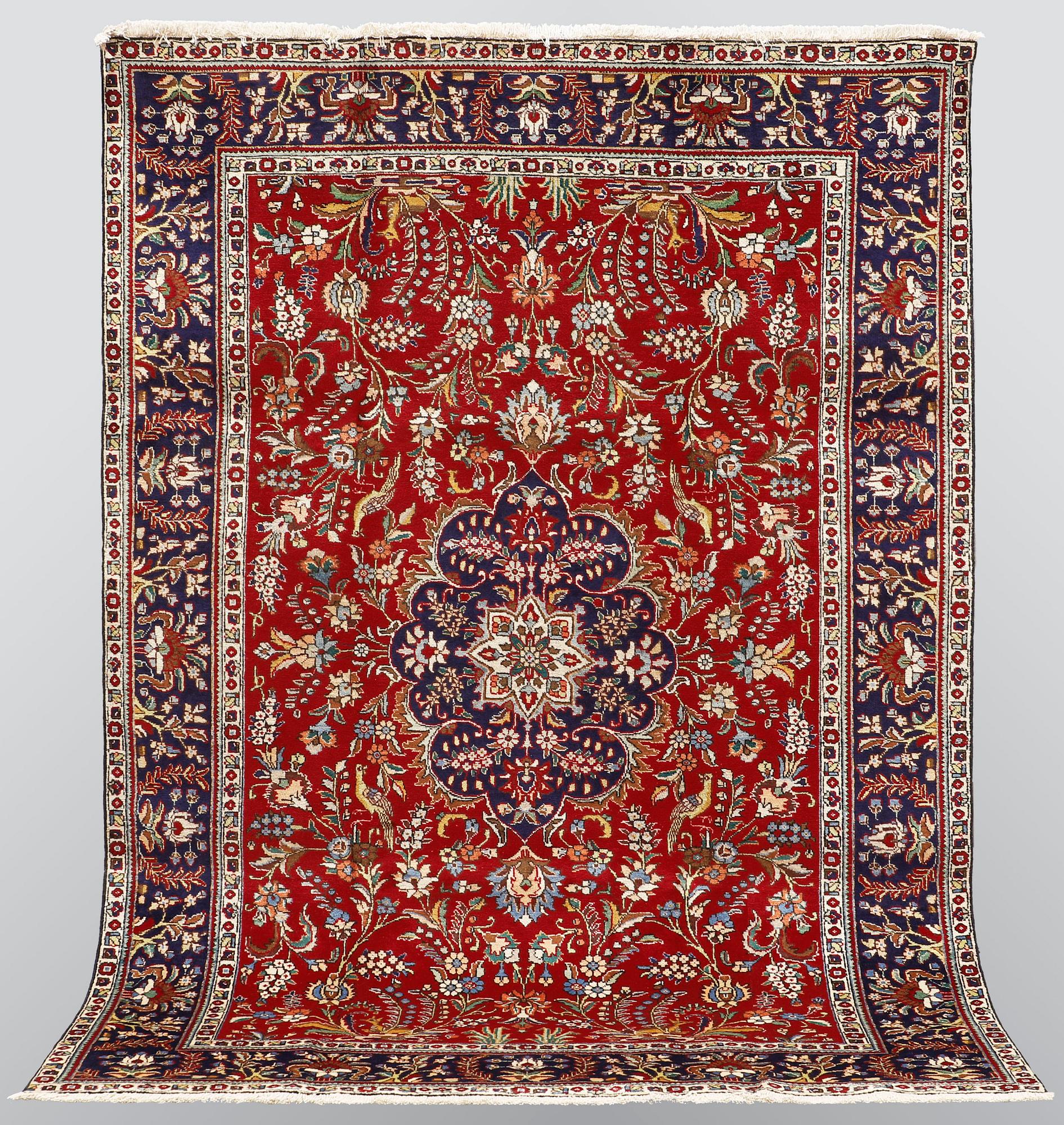 A carpet, Figural Tabriz, ca 310 x 220 cm.