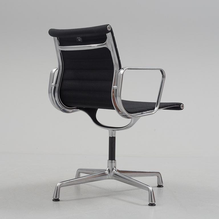 A 'EA 104 Swivel' armchair by Charles & Ray Eames, Vitra, 2016.