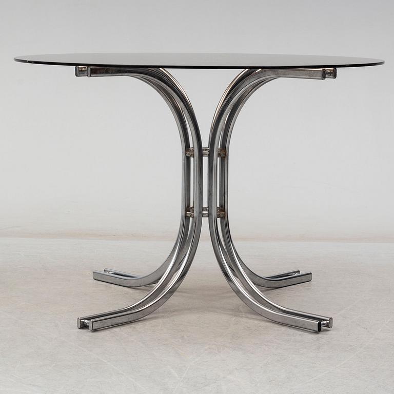 An Italian set of a glass table with four chromed metal chairs, 1970s.