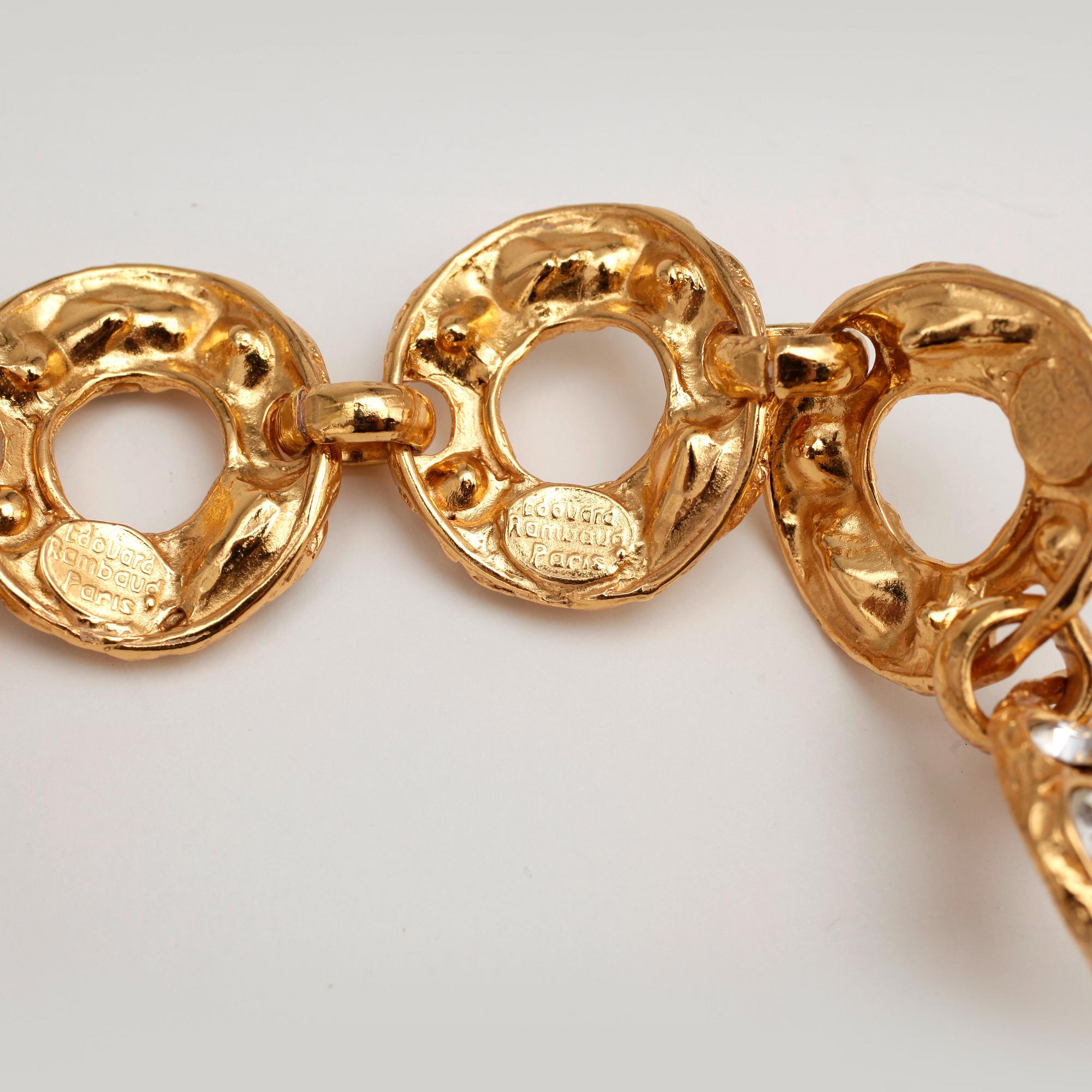 EDOUARD RAMBAUD, a gold colored metal necklace with glasestones cut in various chapes.