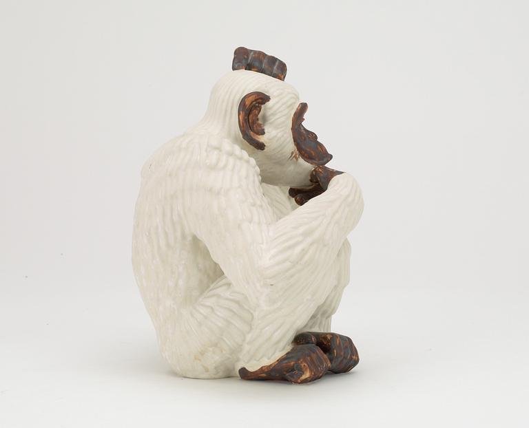 A Gunnar Nylund stoneware figure of a chimpanzee, Rörstrand.