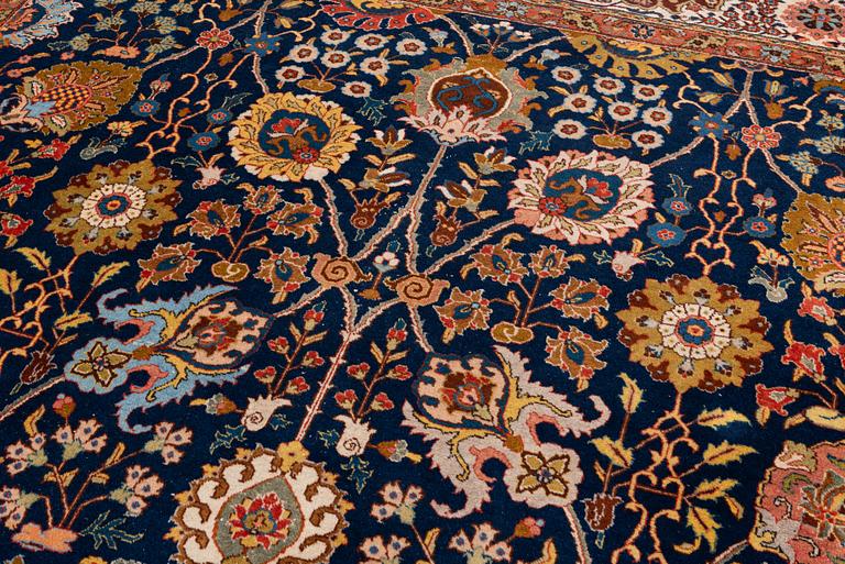 A semi-antique Tabriz carpet, c. 395 x 295 cm.