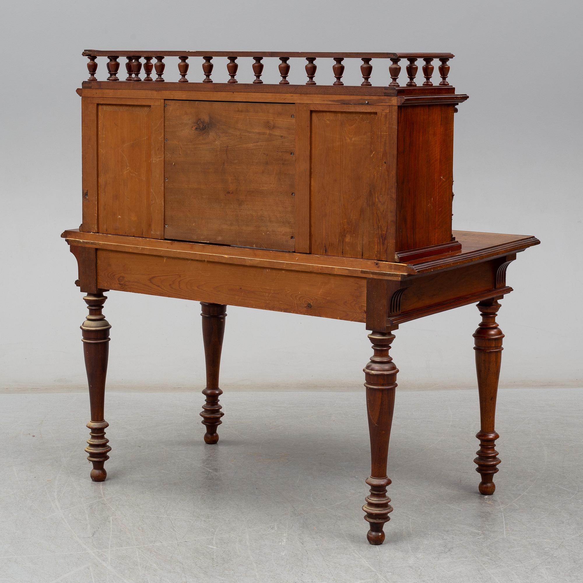 A late 19th century writing desk and armchair.