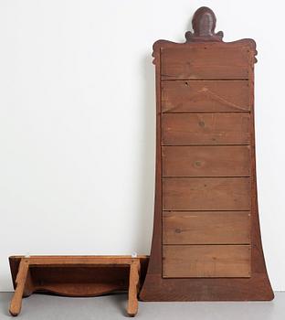 An Art Nouveau oak wall mirror with a console table.