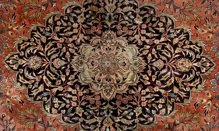 A carpet, Old oriental silk, ca 350 x 275 cm.