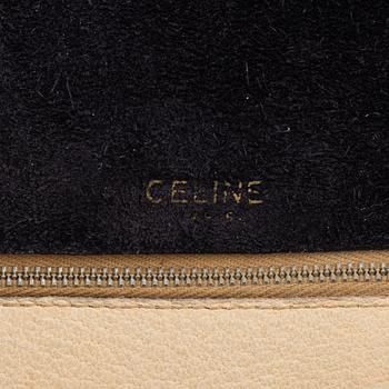 Céline, a black suede handbag.