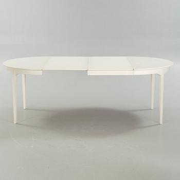 A dining table and six chairs, chairs by Carl Malmsten, model "Herrgården", second half of the 20th century.