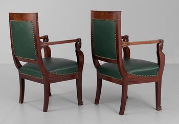 A pair of French Empire early 19th century armchairs.
