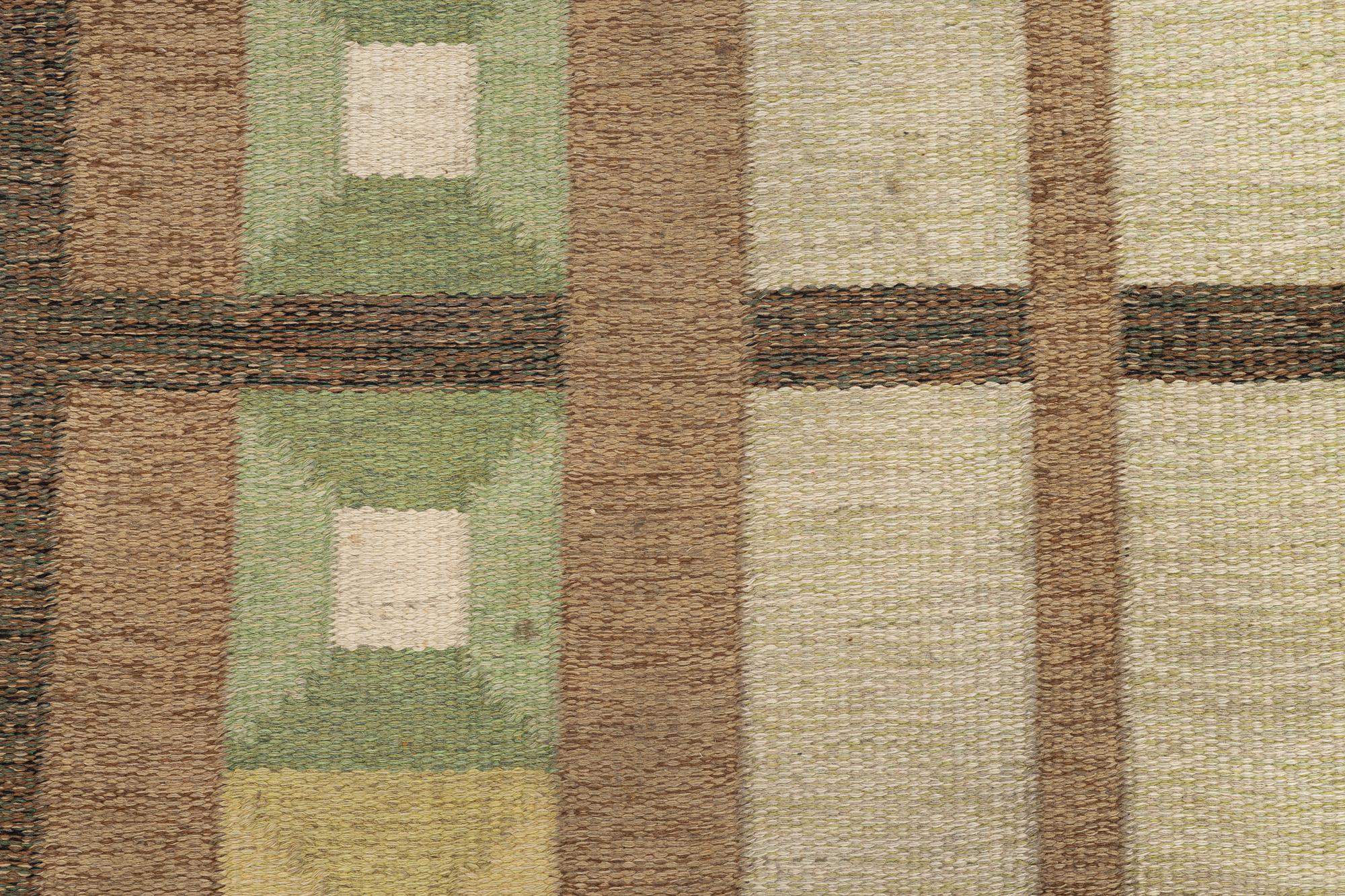 A flat weave carpet, signed, ca. 243 x 165 cm.