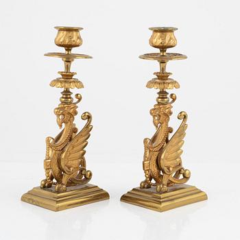 A pair of brass candleholders, 20th century.