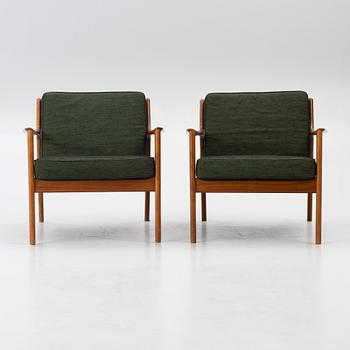 Folke Ohlsson, a pair of 'USA 75' armchairs, Dux, Sweden, 1960's.