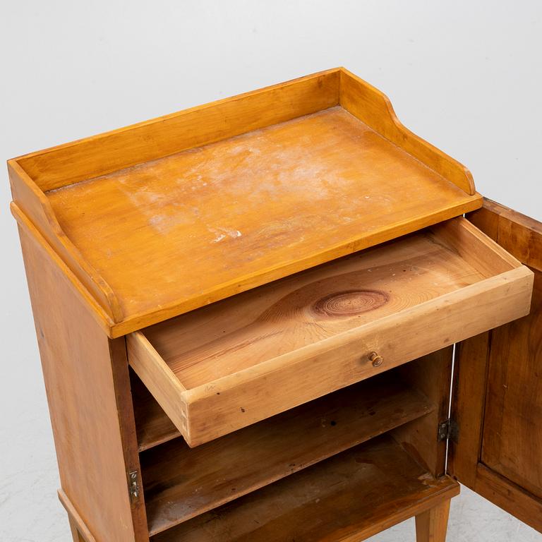 A Gustavian style bedside table, circa 1900.