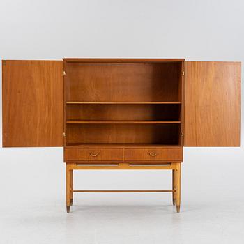 A teak veneered cabinet, mid 20th Century.