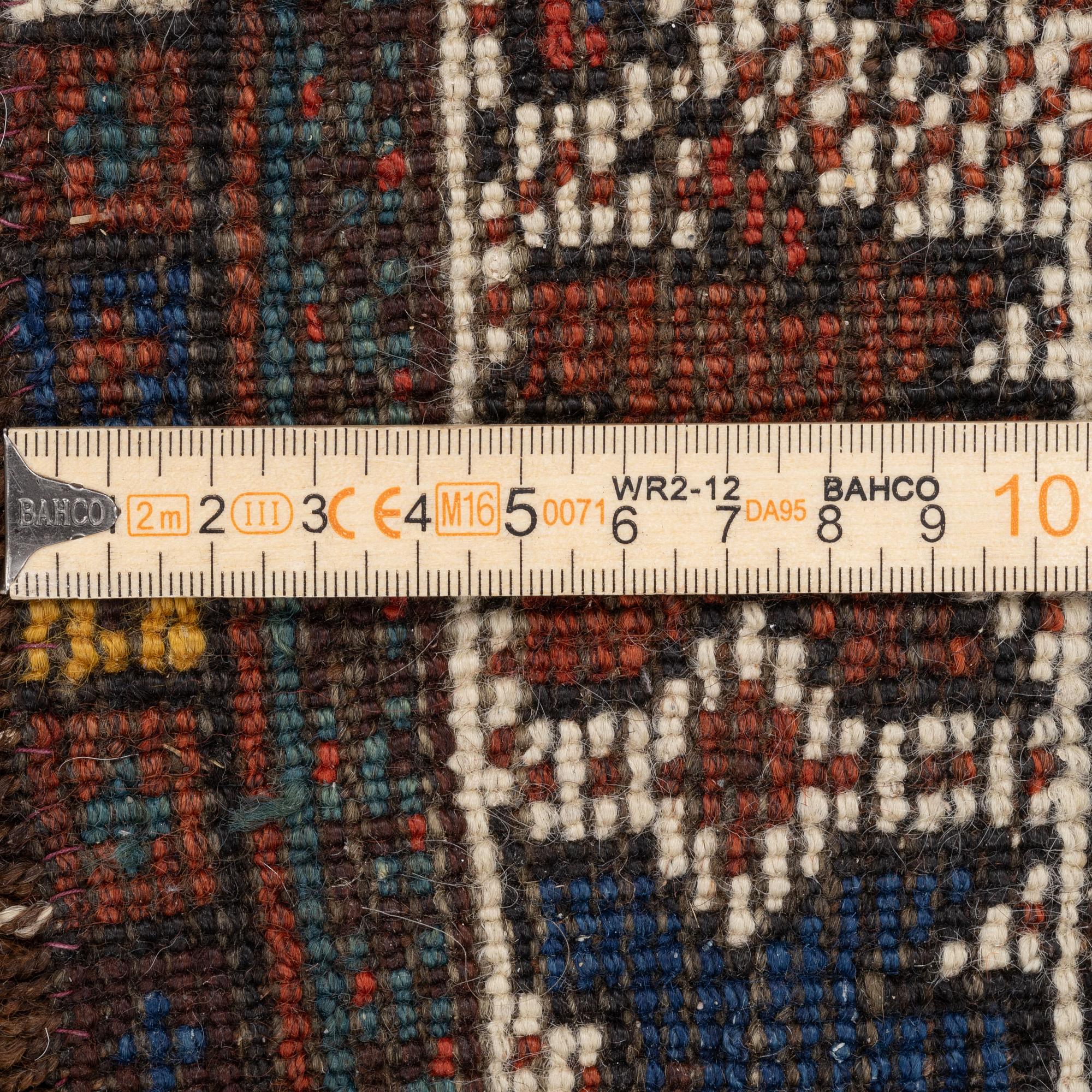 An antique Kamseh rug, c. 150 x 118 cm.