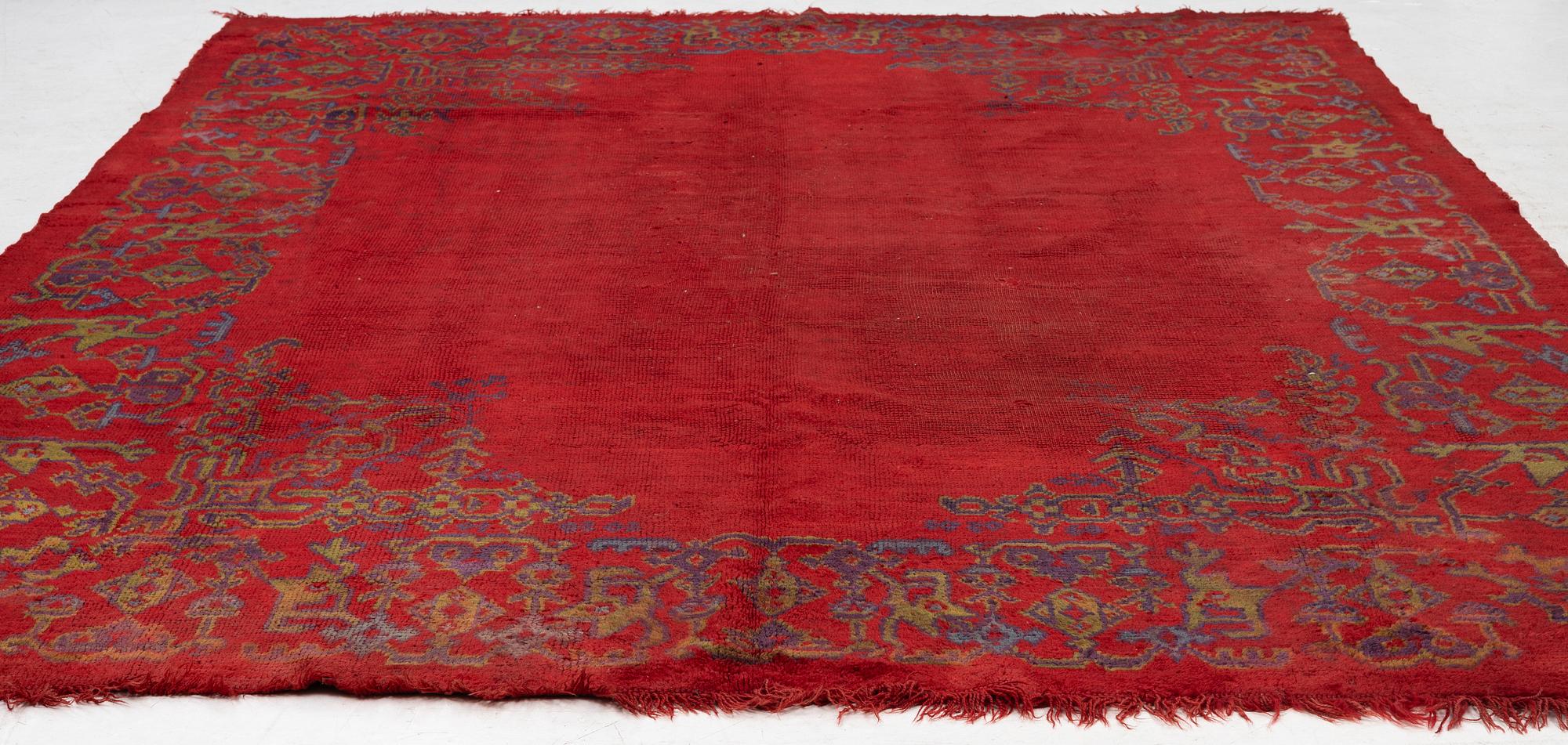 An antique Ushak carpet, West Anatolia, approx. 327 x 250.