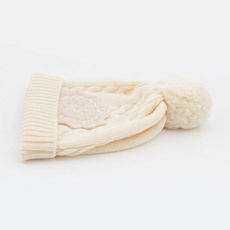 Christian Dior, a set with a pair of wool gloves and a knitted hat.