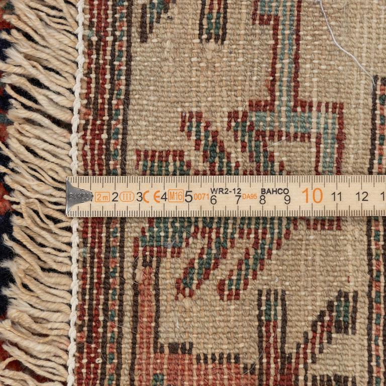 A Heriz rug, c. 192 x 133-139 cm.