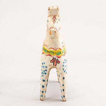 A Swedish painted and dated 1945 wooden horse.