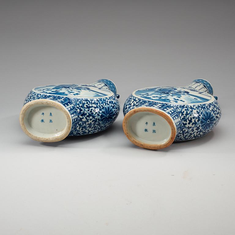 A pair of large blue and white moon flasks, late Qing dynasty (1644-1912), with Kangxi four character mark.