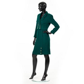 CHANEL, a two-piece suit consisting of short jacket and skirt.