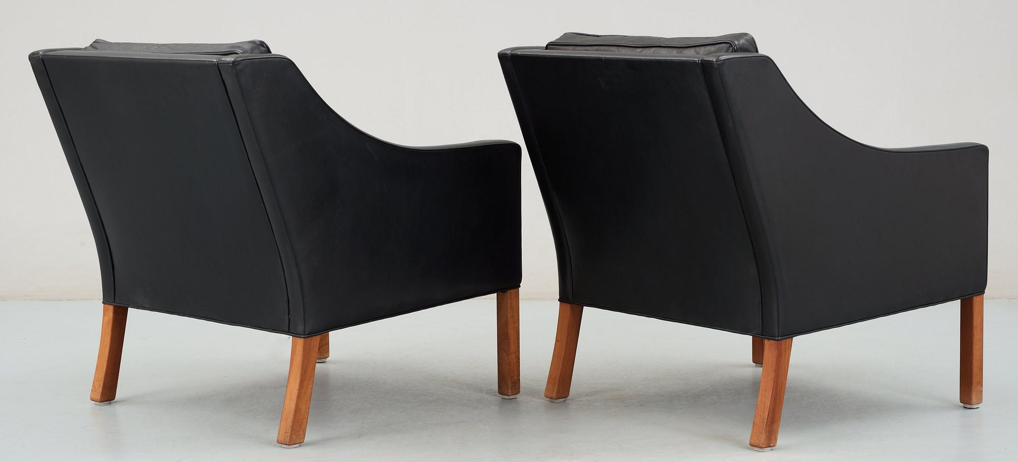 A pair of black leather Børge Mogensen armchairs, Fredericia, Denmark.