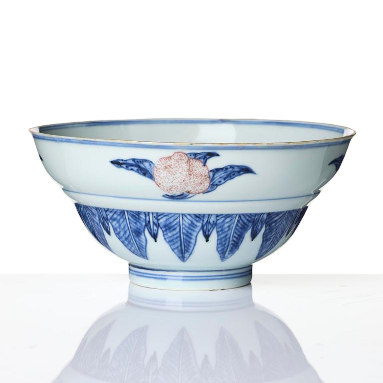 A blue and white and copper-red 'peaches' bowl, Qing dynasty.