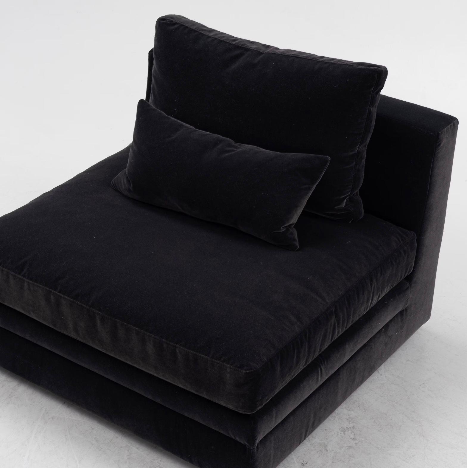Two 21st century lounge chairs.