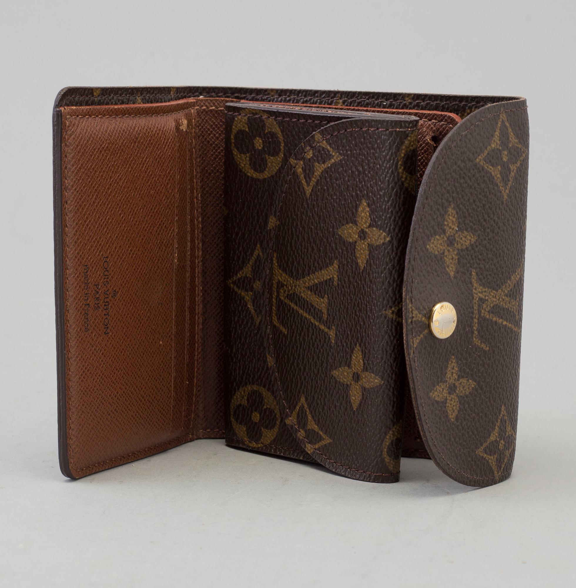 a LOUIS VUITTON 'Helene' wallet.